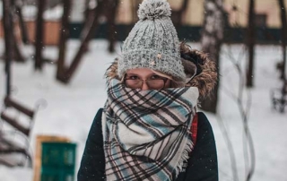 Woman bundled in winter clothes.