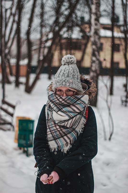 Woman bundled in winter clothes.
